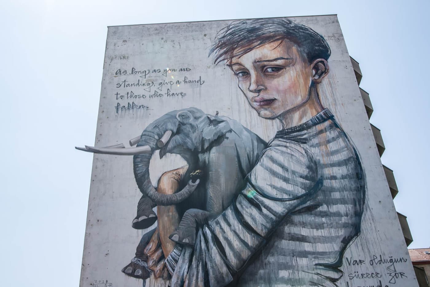 Boy with elephant mural by Herakut, Onur and Wes in Moabit, Berlin